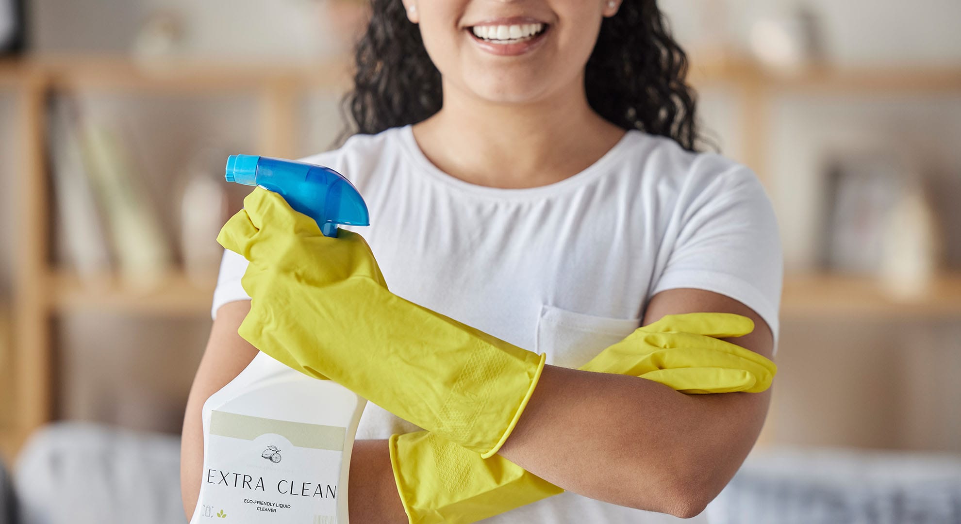 Cleaning woman with spray bottle.